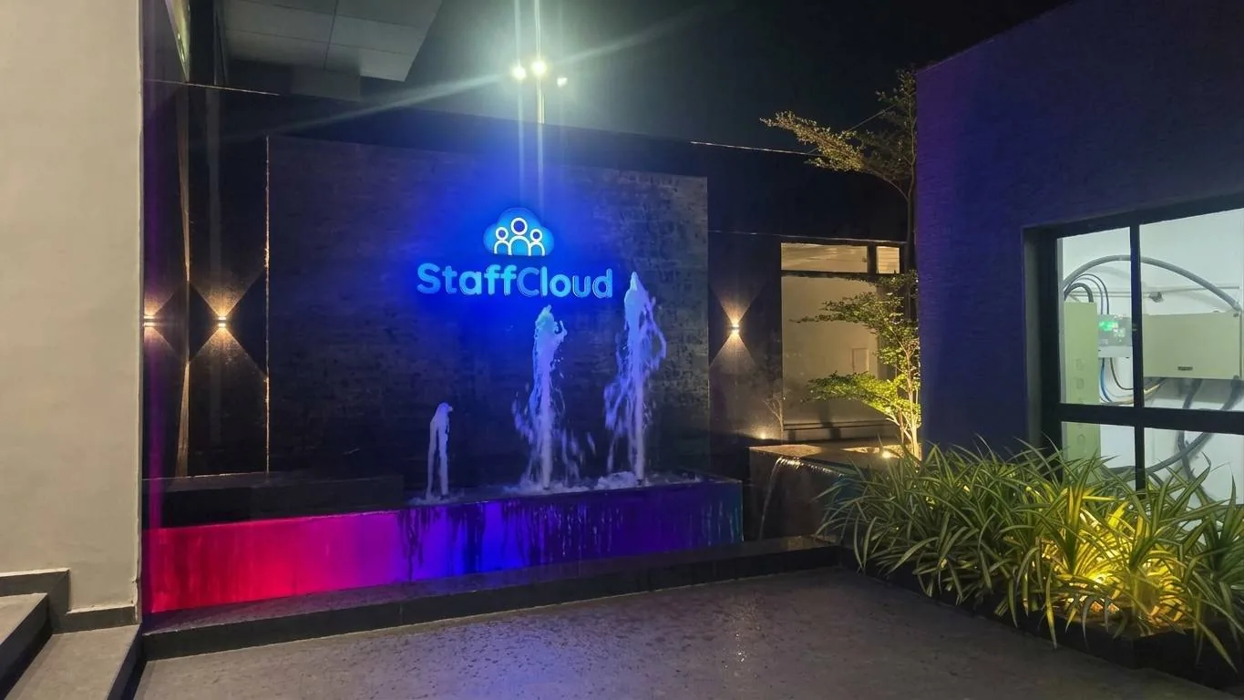 The building entrance lit at night